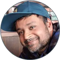 Photo of Kamal in a baseball cap
